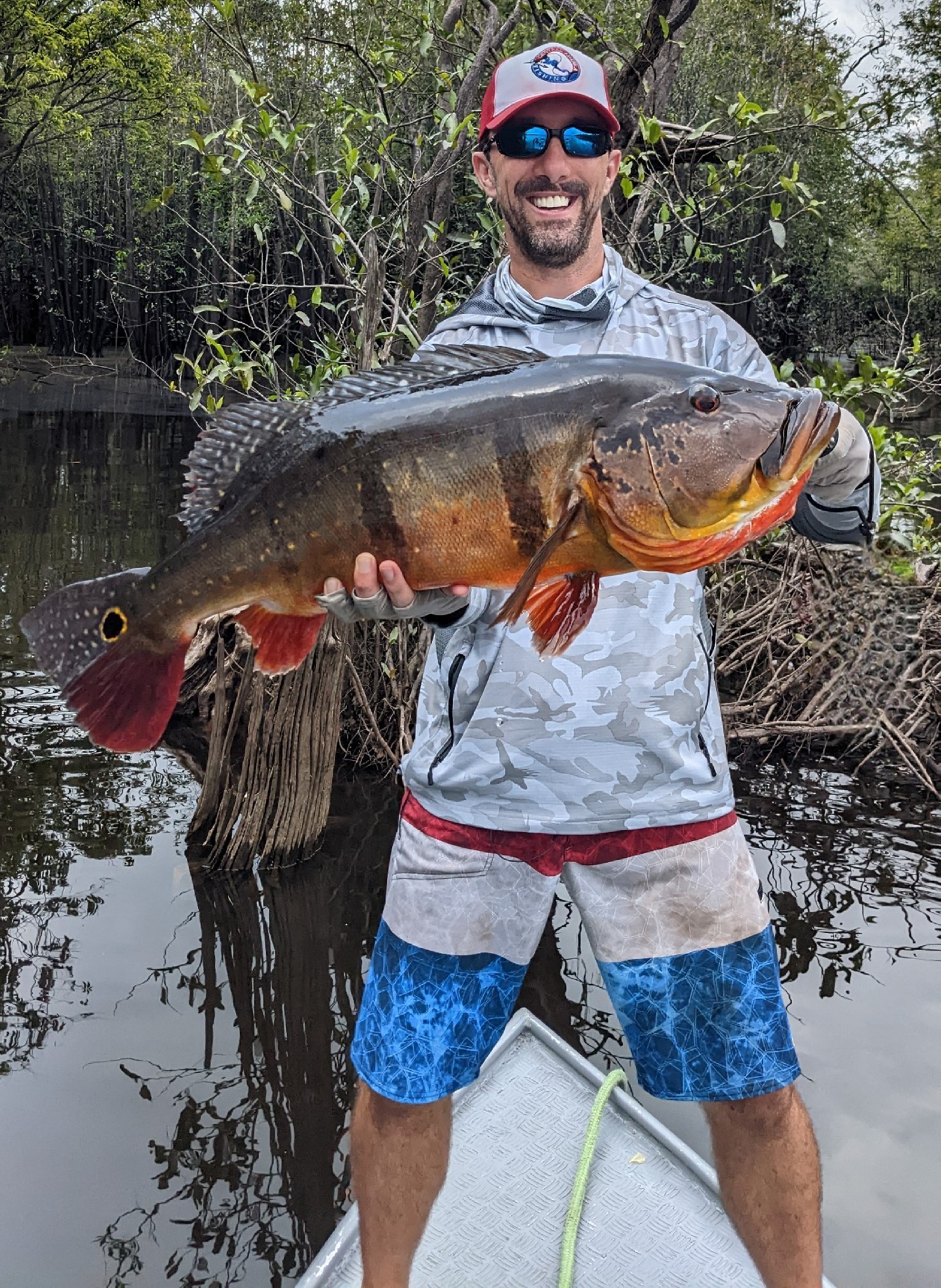 CAF owner, Chris Atkins, and his personal best 20 lb peacock bass in Brazil